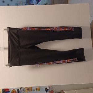 Lululemon Athletica black leggings with stained glass look on sides